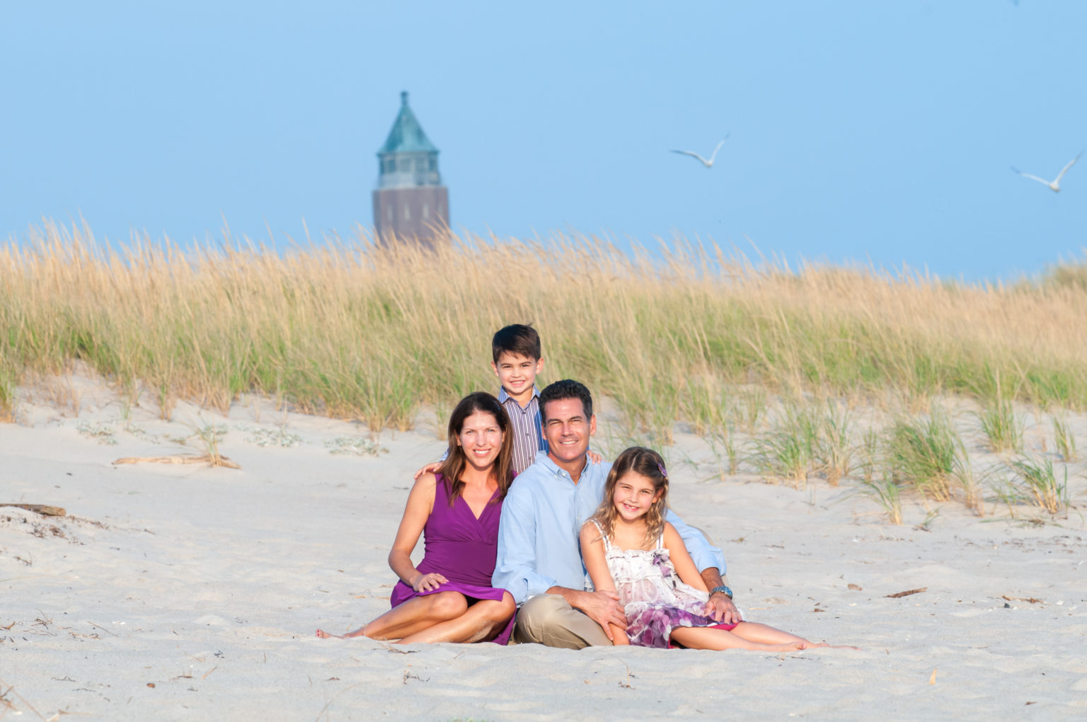 Family of five photographed by Long Island family photographers at Robert Moses State Park