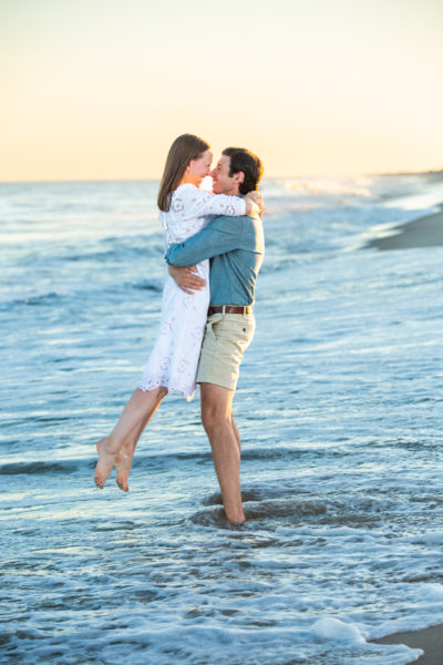 Man and woman photographed by Hamptons photographer on the beach