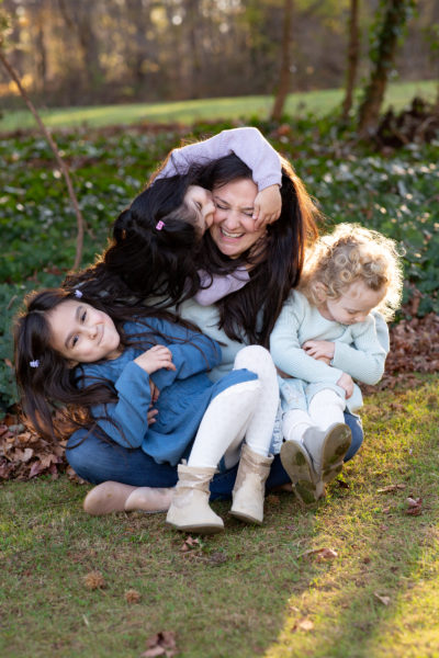 Children playing with their mother during photoshoot in Long Island, NY