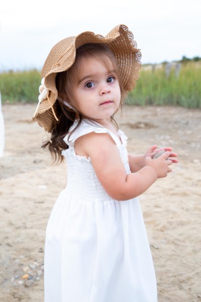 Toddler photographed on the beach in the Hamptons.