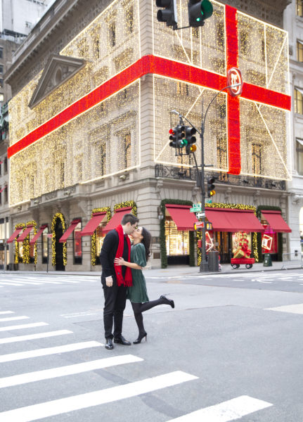 Couple standing in New York City during Christmas 